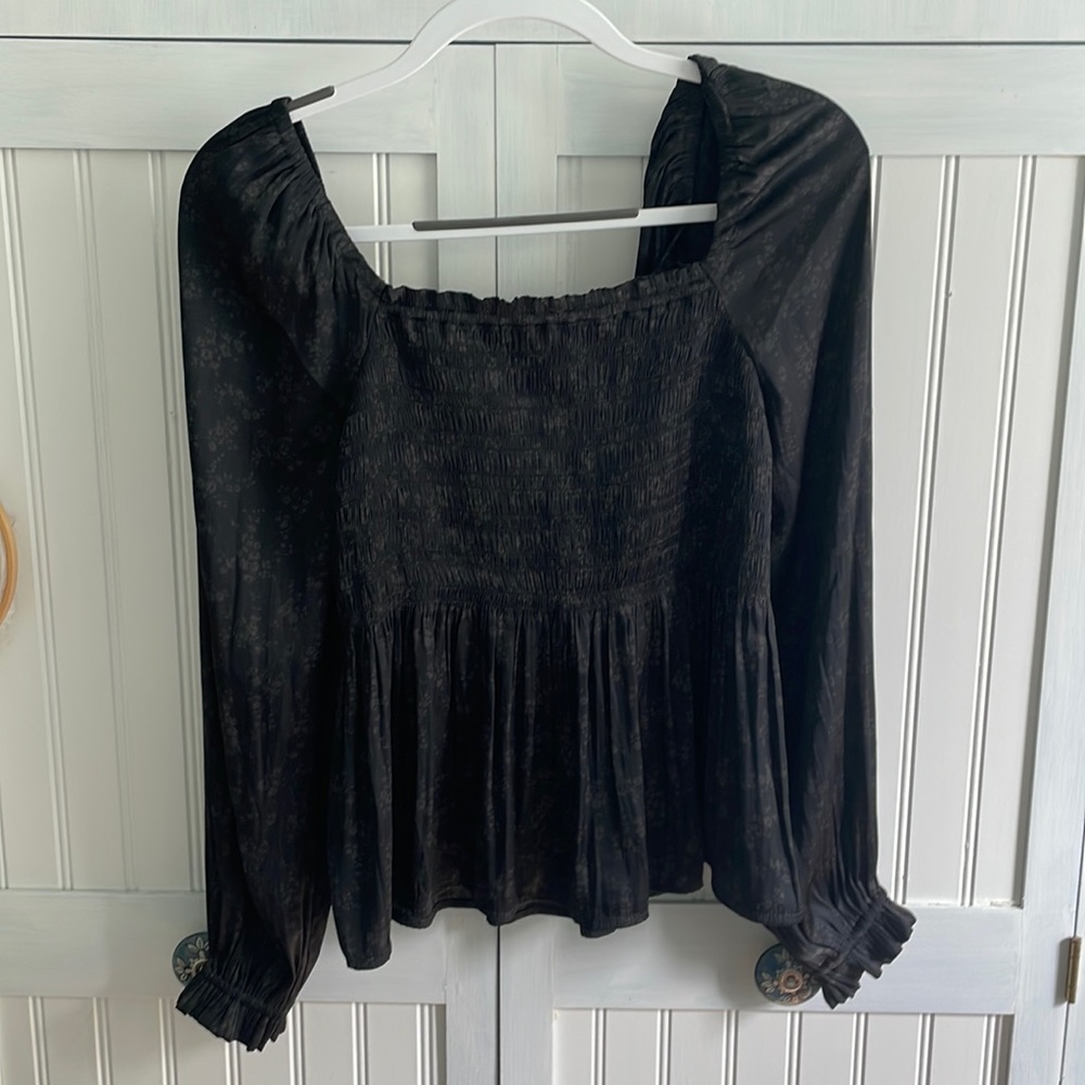 NWT Black silky peplum blouse. Size M.